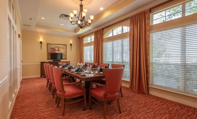 Elegant dining room with a large table set for meals