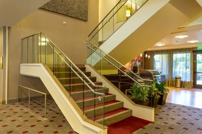 Stairs in a well-lit interior of a senior living facility