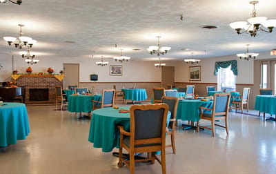 Dining room with tables set for residents