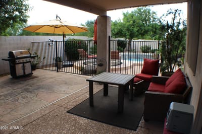 Patio area with seating and grill