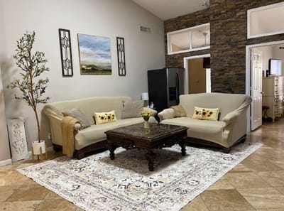 Cozy sitting area in the facility with plants and artwork