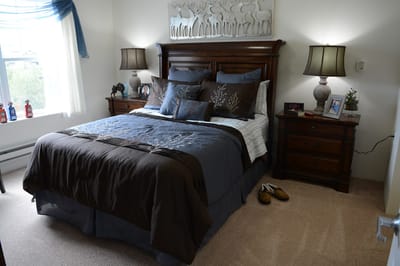 Cozy private resident room with a bed and decor