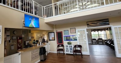 Bright interior of the facility's common area with seating and activities