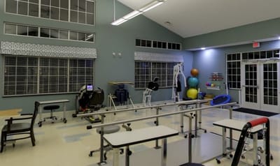 Interior view of a rehabilitation gym with exercise equipment