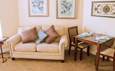 Cozy sitting area with a couch and dining table
