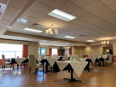 Bright dining room setup with tables and chairs