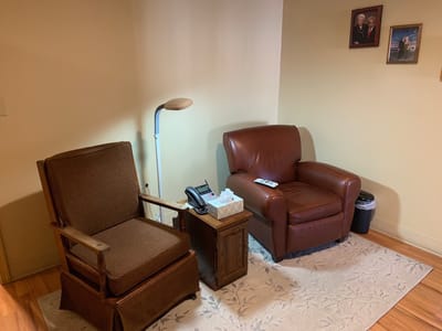 Cozy corner of a facility's living space with chairs and decor