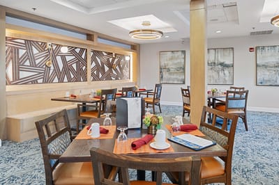 Dining area with beautifully set tables and decor