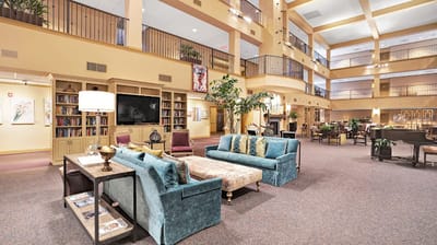 Bright common area with seating and bookshelves