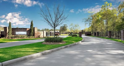 Entrance road to Christwood Retirement Community with landscaped surroundings