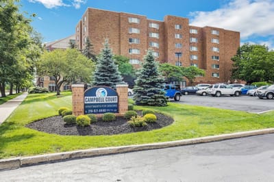 Exterior view of Campbell Court Senior Apartments with landscaping
