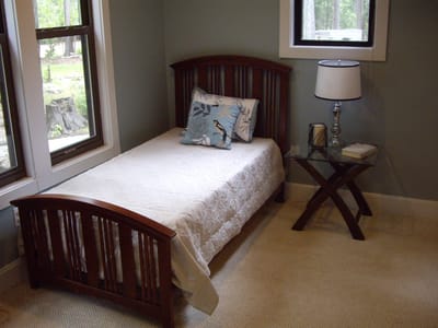 A single bed in a cozy resident room