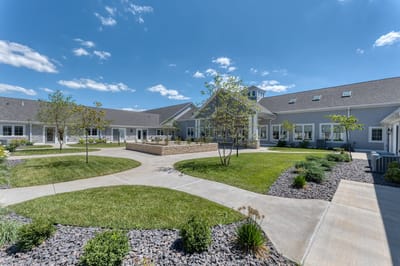 Outdoor courtyard area with landscaping and pathways