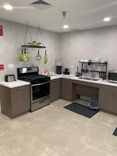 Modern kitchen area with appliances and clean design