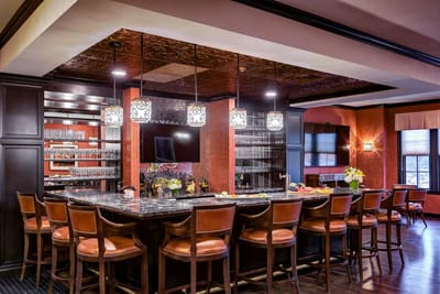 Interior view of a bar area with seating and food