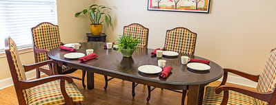 Cozy dining room setup with a large table and chairs