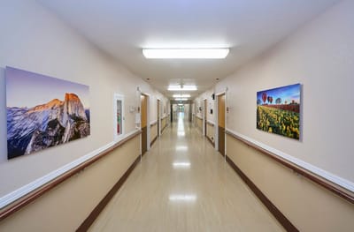 Interior hallway with artwork on the walls