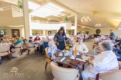Residents enjoying breakfast in a dining area