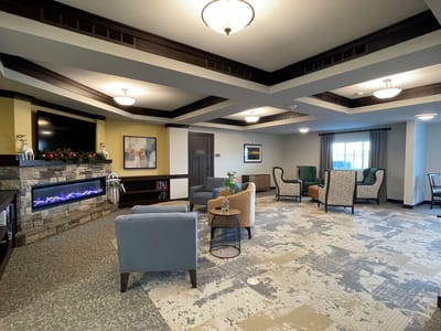 Cozy common area with seating and decorative fireplace
