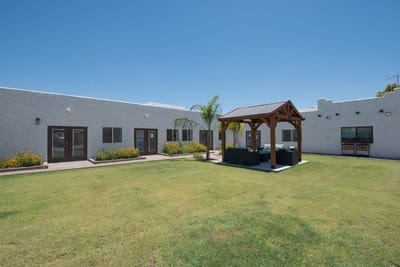 Outdoor area with gazebo and landscaped lawn
