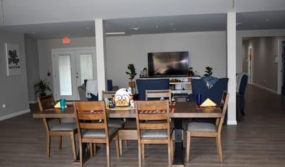 Dining area with a table set for residents
