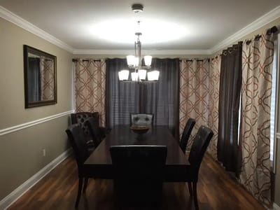 Bright dining room with large table and chairs