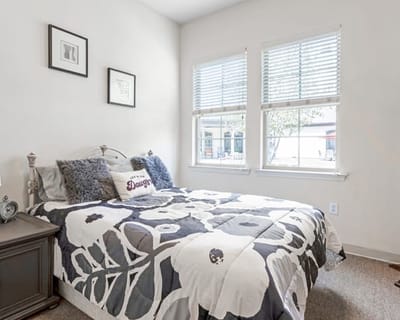Cozy bedroom setup with floral bedding and decor