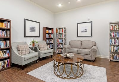 Cozy common area with seating and bookshelves