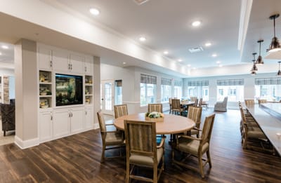 Bright common area with seating and tables