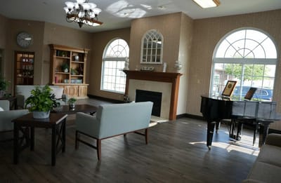 Bright common area with seating and piano