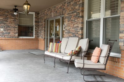 Outdoor seating area with decorative pillows