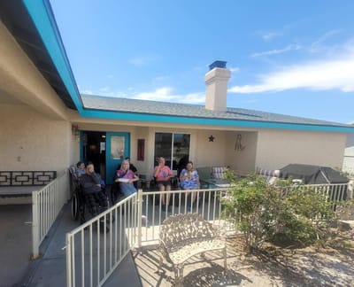Residents enjoying time outdoors on the patio