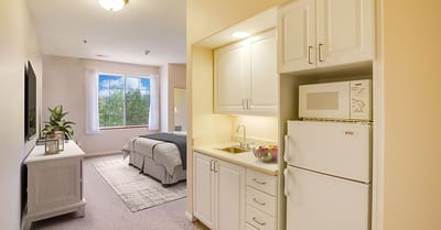Cozy interior view of a resident room with kitchenette