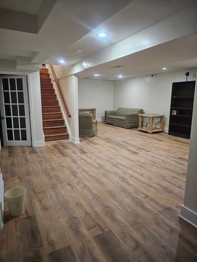 Spacious common area with seating and stairs