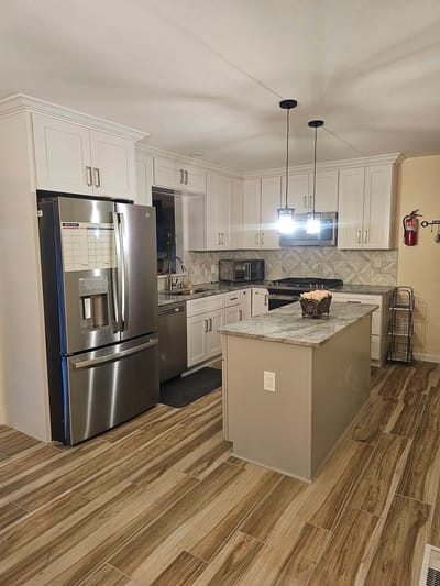Brightly lit kitchen with modern appliances