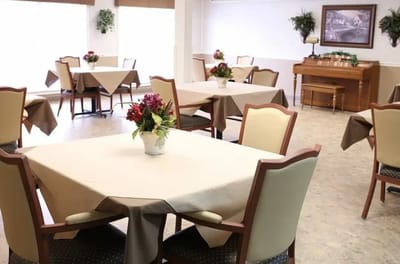 Dining room with tables set for meals