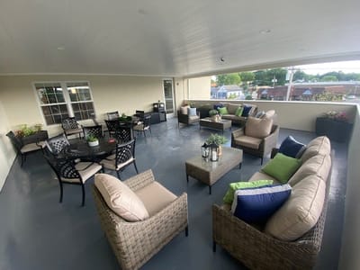 Outdoor seating area with tables and chairs