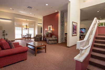 Bright common area with seating and TV