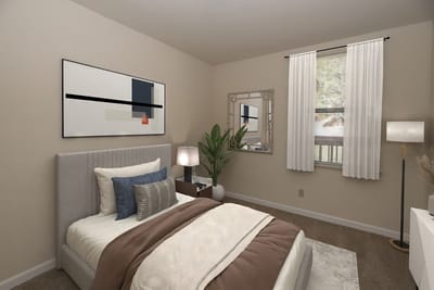 A well-decorated private resident room with neutral colors