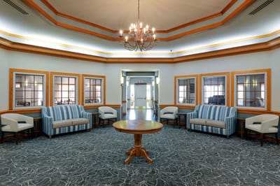 Interior common area with seating and chandeliers