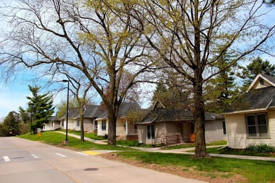 Houses along a walkway in a scenic outdoor area.