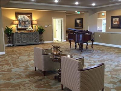 Interior view of a common area with a piano