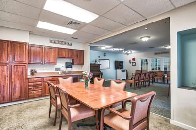 Common area with dining table and kitchenette