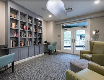 Interior common area with bookshelves and seating