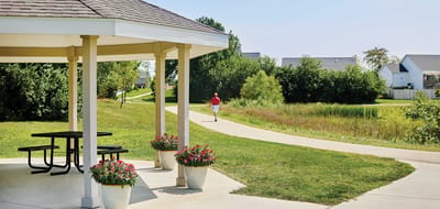 Pathway with a gazebo and a person walking