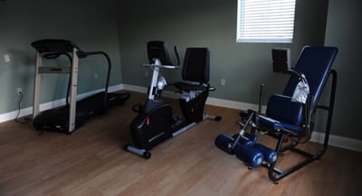 Interior view of a senior fitness room with exercise equipment