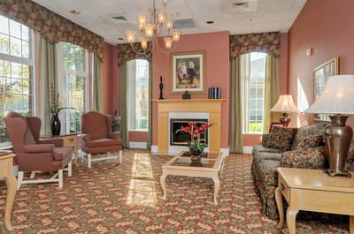 Cozy lounge area with seating and a fireplace