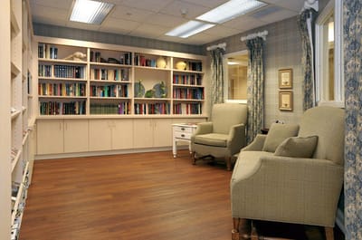 A cozy reading area with bookshelves and seating