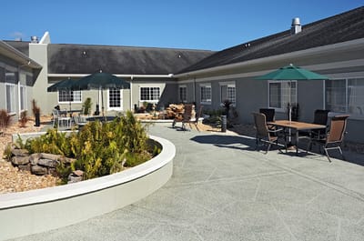 Outdoor patio area with seating and umbrellas