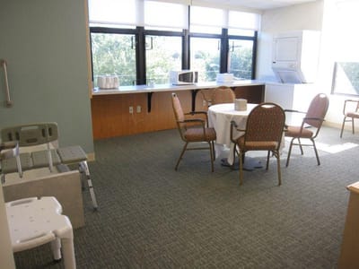 Bright interior common area with dining table and chairs